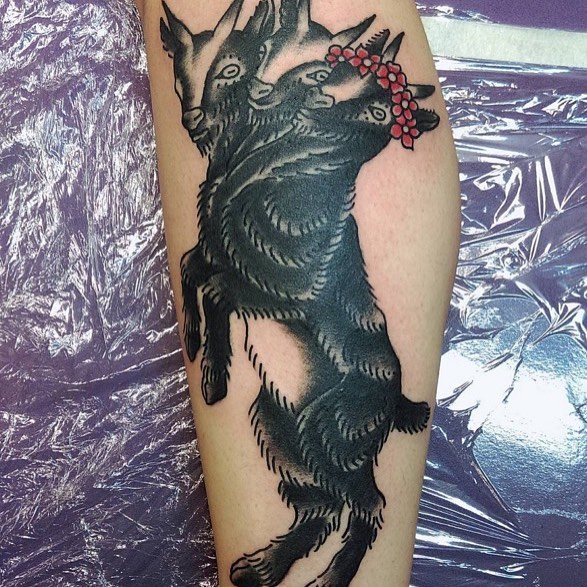 Black tattoo of a triceps goat