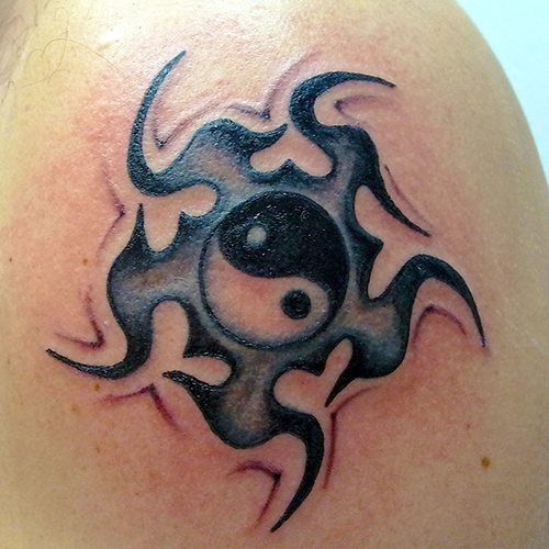 Yin-Yang tattoo. What does it mean, sketches on the arm, neck, back, leg for two, men, girls. Photo