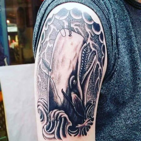 Whale tattoo on the shoulder