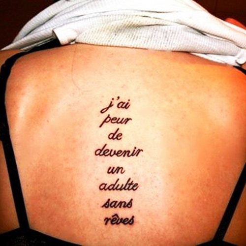 Beautiful phrase on the tattoo of the girl, the boy