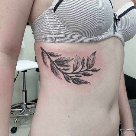 Laurel wreath tattoo on the side