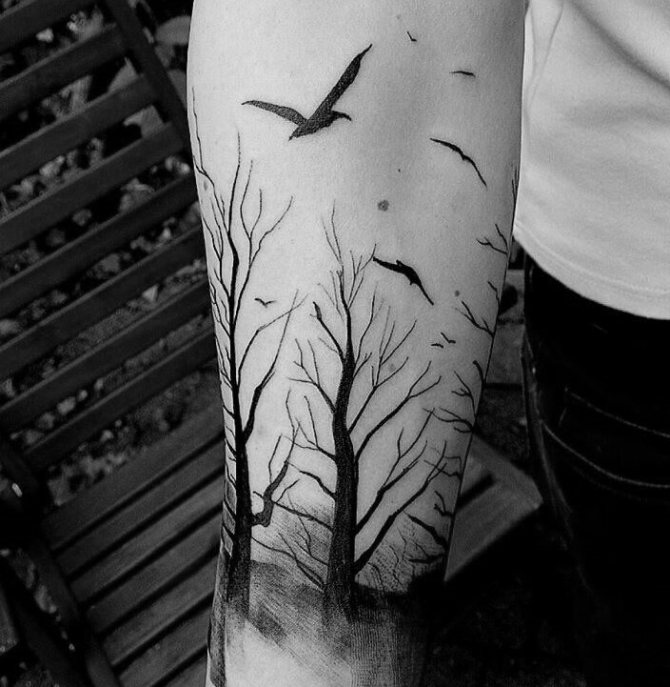 Birds flying over the trees - a spectacular tattoo