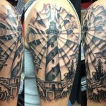 Lighthouse tattoo on the shoulder