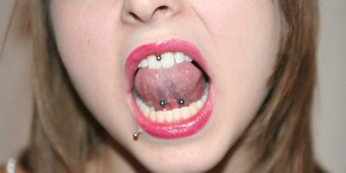 Tongue ligature piercing