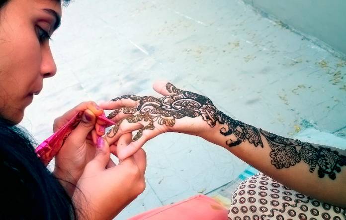 The process of applying henna