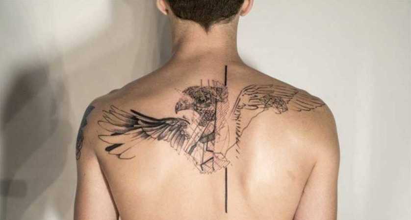 sketch style tattoo on his back