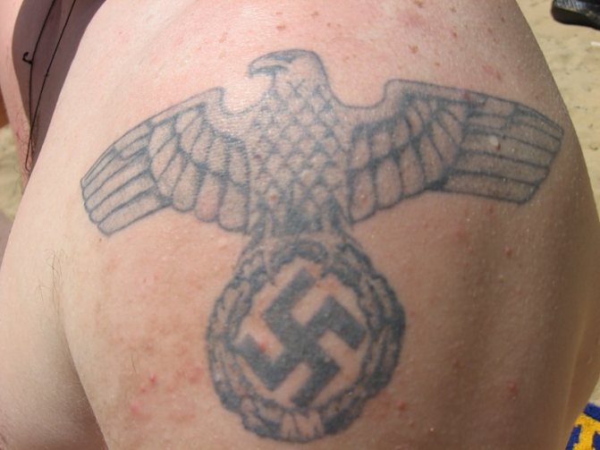 Swastika tattoo as a sign of rejection of the regime