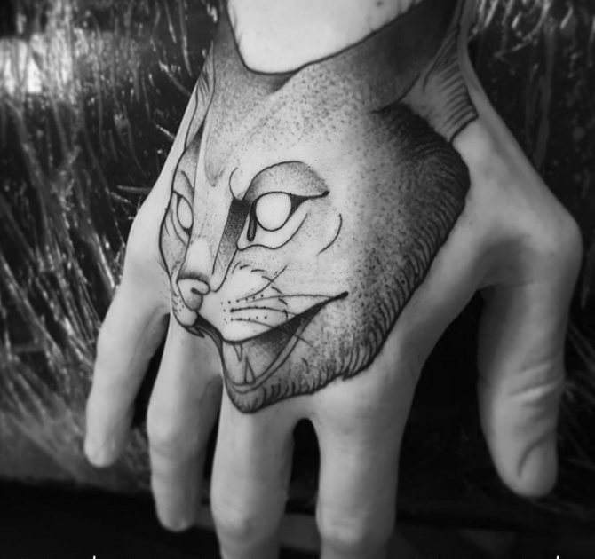Tattoo of an aggressive cat in dotwork style