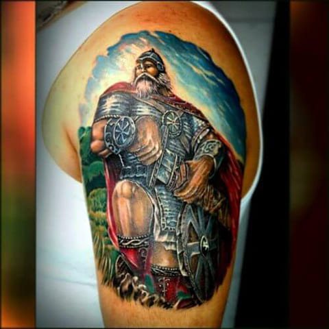 Tattoo of a bogatyr on his shoulder