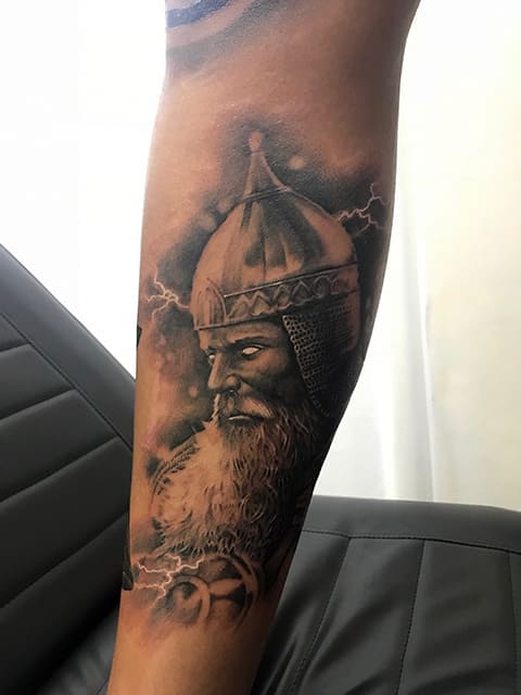 Tattoo Tycoon on his arm