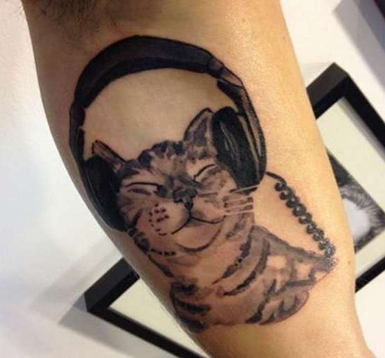Tattoo of a cat with headphones