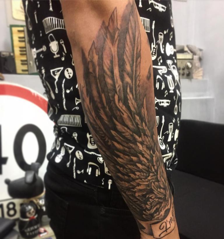 Tattoo wings fits perfectly on the male forearm
