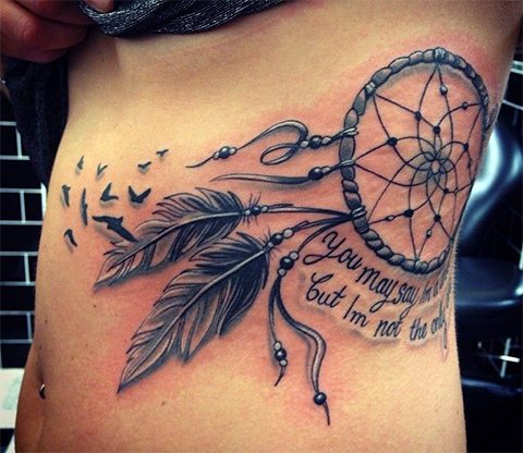 Tattoo dream catcher on the girl's side - photo