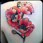 Tattoo of poppies on his scapula