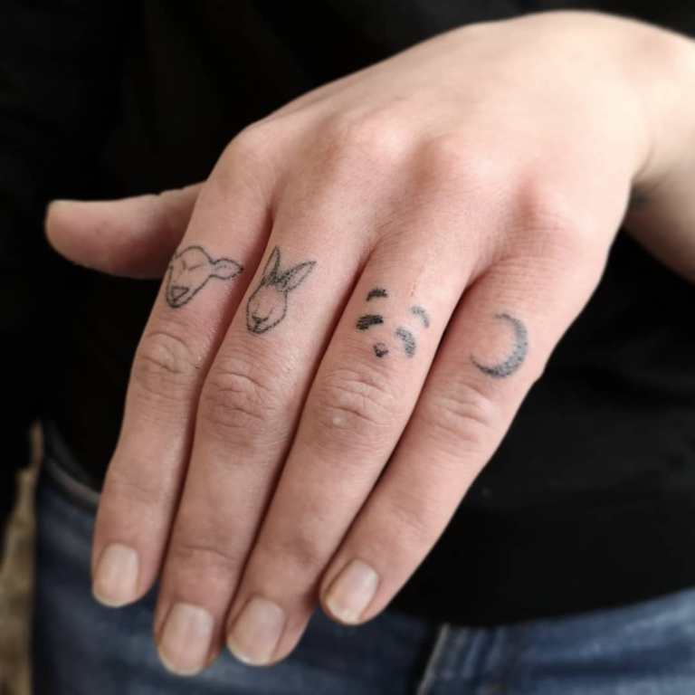 tattoo between fingers