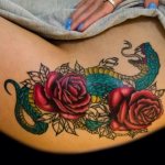 Tattoo on the hip for girls: sketches, patterns, inscriptions, small tattoos, flowers, animals, dragons, roses. Photo