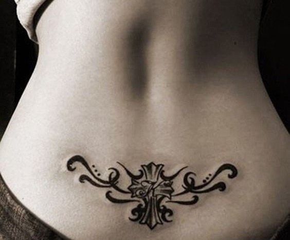 Tattoo on the coccyx for girls. Tattoo on the coccyx of girls.