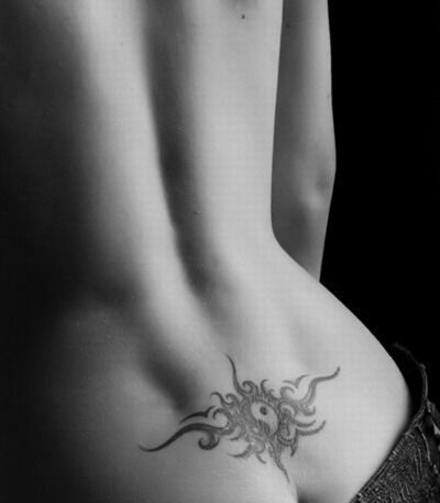 Tattoo on the coccyx for girls. Tattoo on the coccyx of girls.