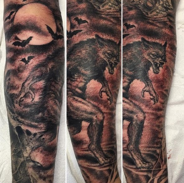 Tattoo of a werewolf on a guy's leg