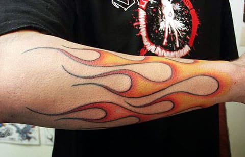 Tattoo of fire on a man's arm