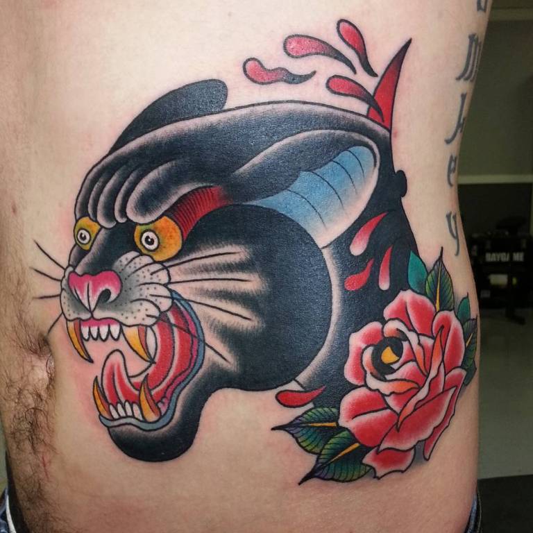 Tattoo panther on the side of a man