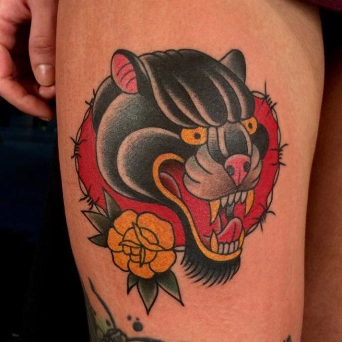 Panther tattoo on thigh