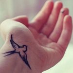 Tattoo of a bird on the wrist meaning