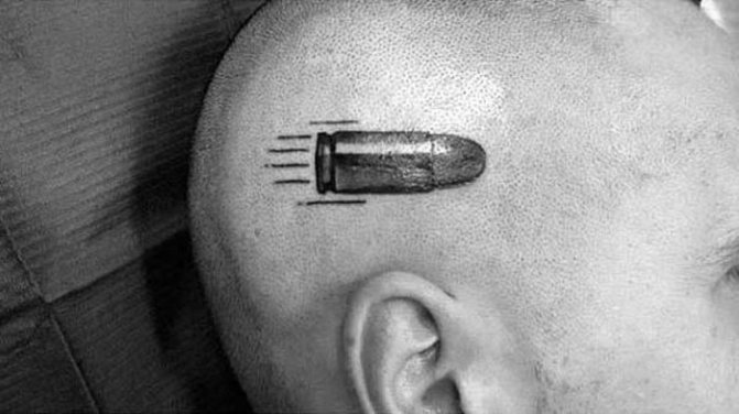 tattoo of a bullet on his head