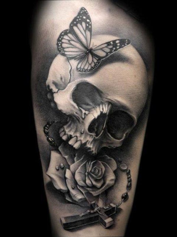 Tattoo of a rose with skull on his shoulder