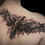 Tattoo with a raven
