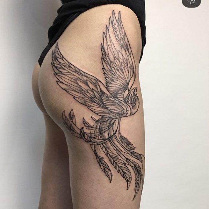 Firebird tattoo for girls black on her thigh