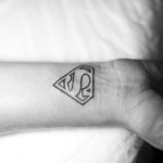 superhero sign tattoo
