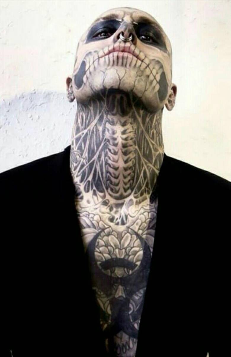 Skull tattoo on face, neck and chest
