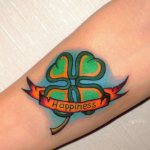 Tattoo of a clover with the inscription