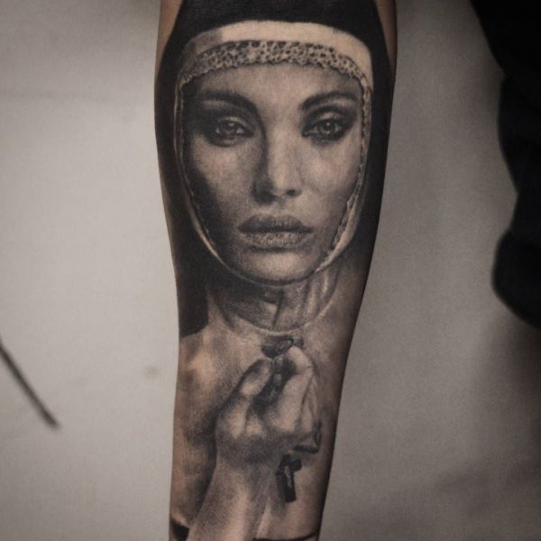 Tattoo of a nun with full lips