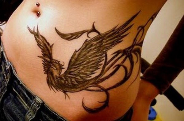 Tattoo on the abdomen for girls after childbirth to hide stretch marks. Pros and cons.