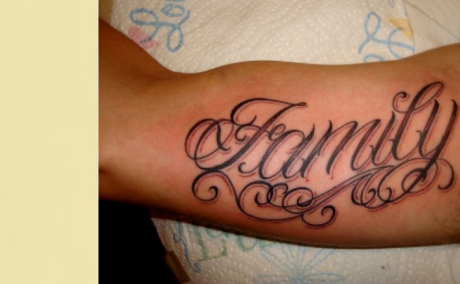 Tattoo - an inscription on the arm