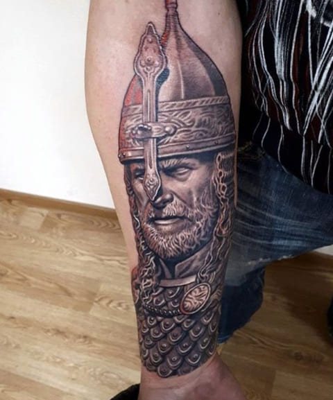 Tattoo of a bogatyr in a helmet
