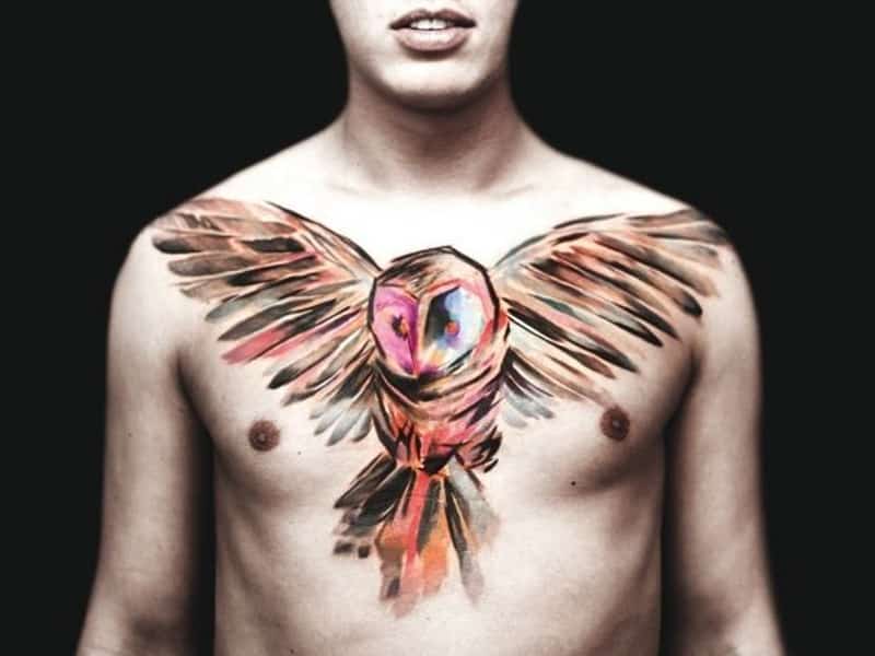 Tattoo of an owl in a guy