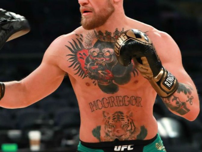 McGregor's torso, with tattoos.